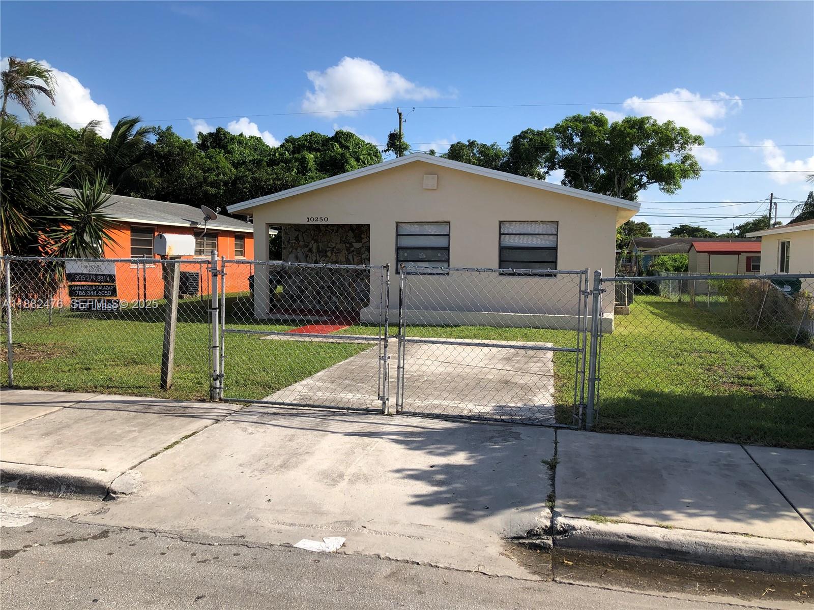 10250 Southwest 172nd Street Miami, FL 33157 - Photo 31 of 39 a view of a house with backyard