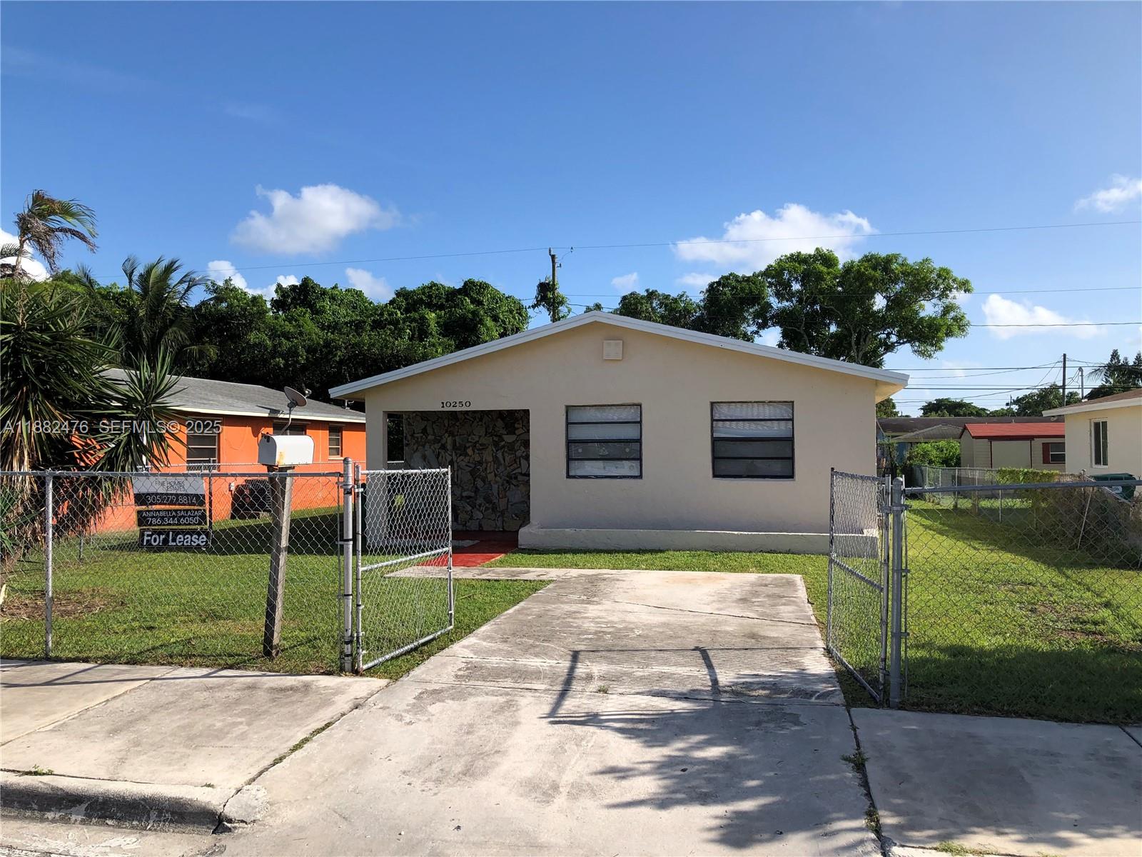 10250 Southwest 172nd Street Miami, FL 33157 - Photo 32 of 39 a view of a house with backyard