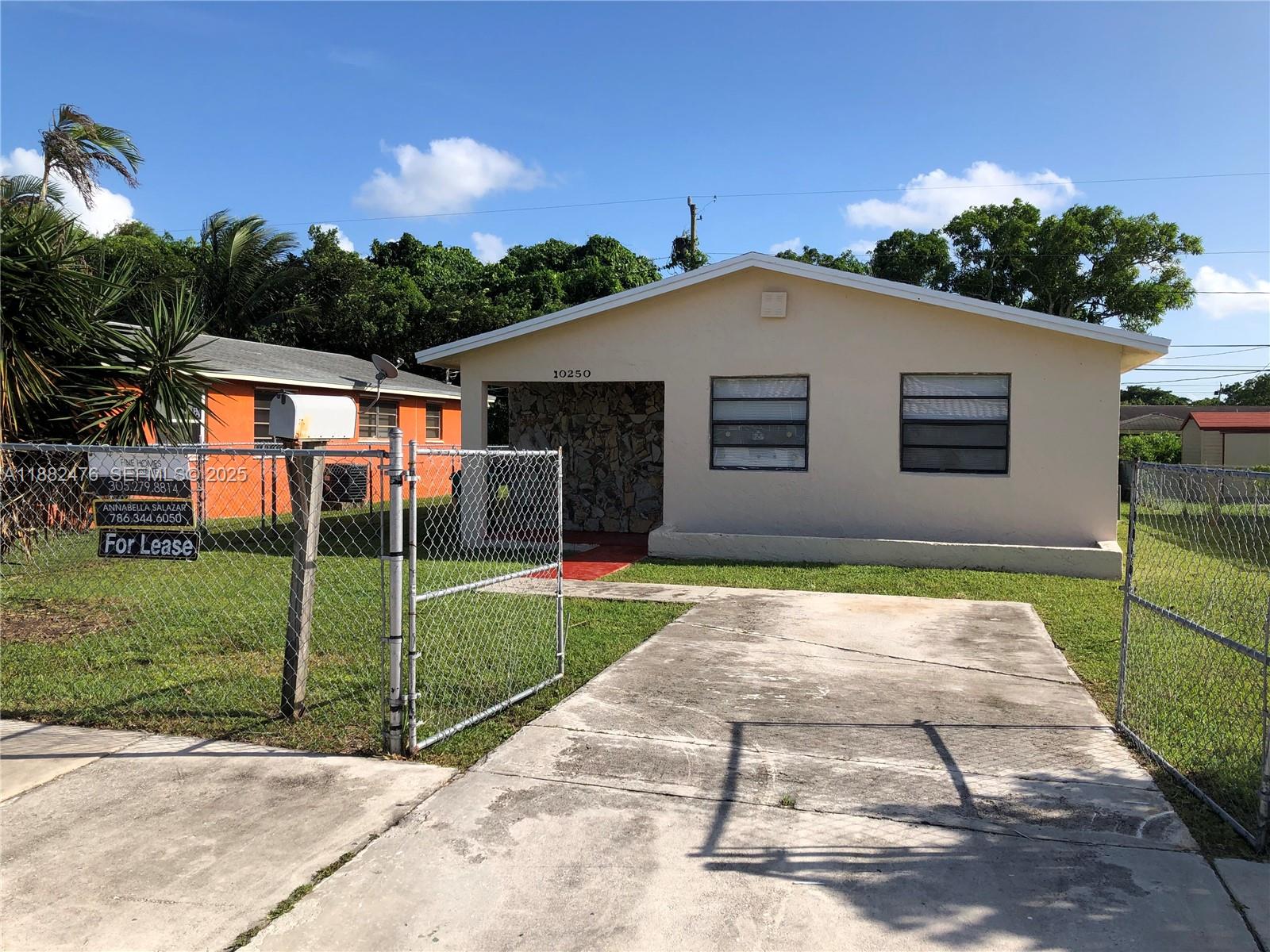 10250 Southwest 172nd Street Miami, FL 33157 - Photo 37 of 39 a view of backyard of house with green space