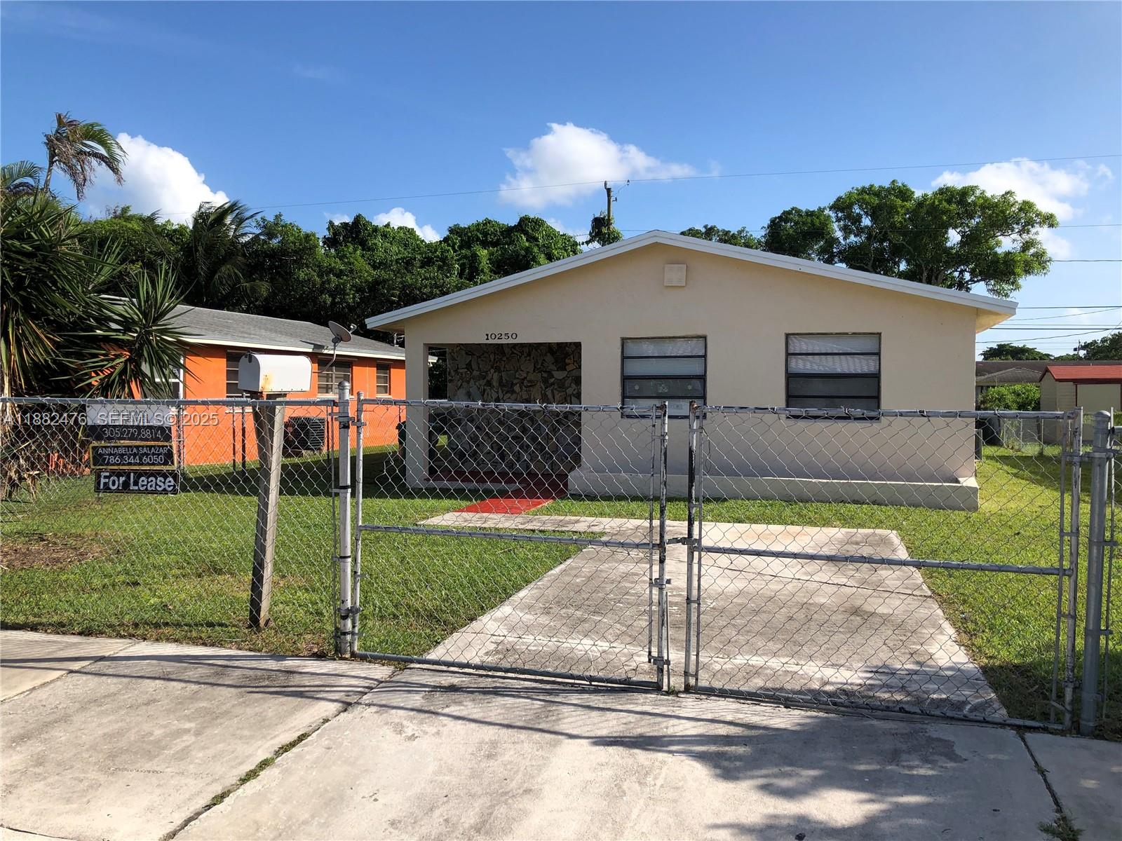 10250 Southwest 172nd Street Miami, FL 33157 - Photo 39 of 39 a backyard of a house with table and chairs