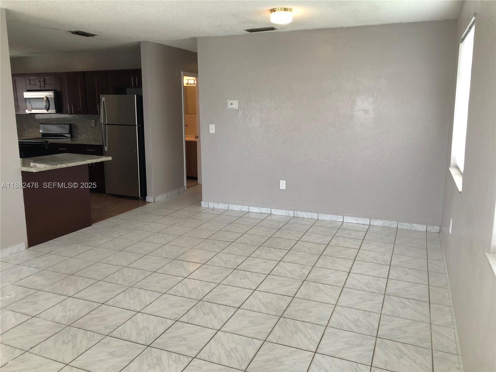 10250 Southwest 172nd Street Miami, FL 33157 - Photo 4 of 39 view of an empty room and a window