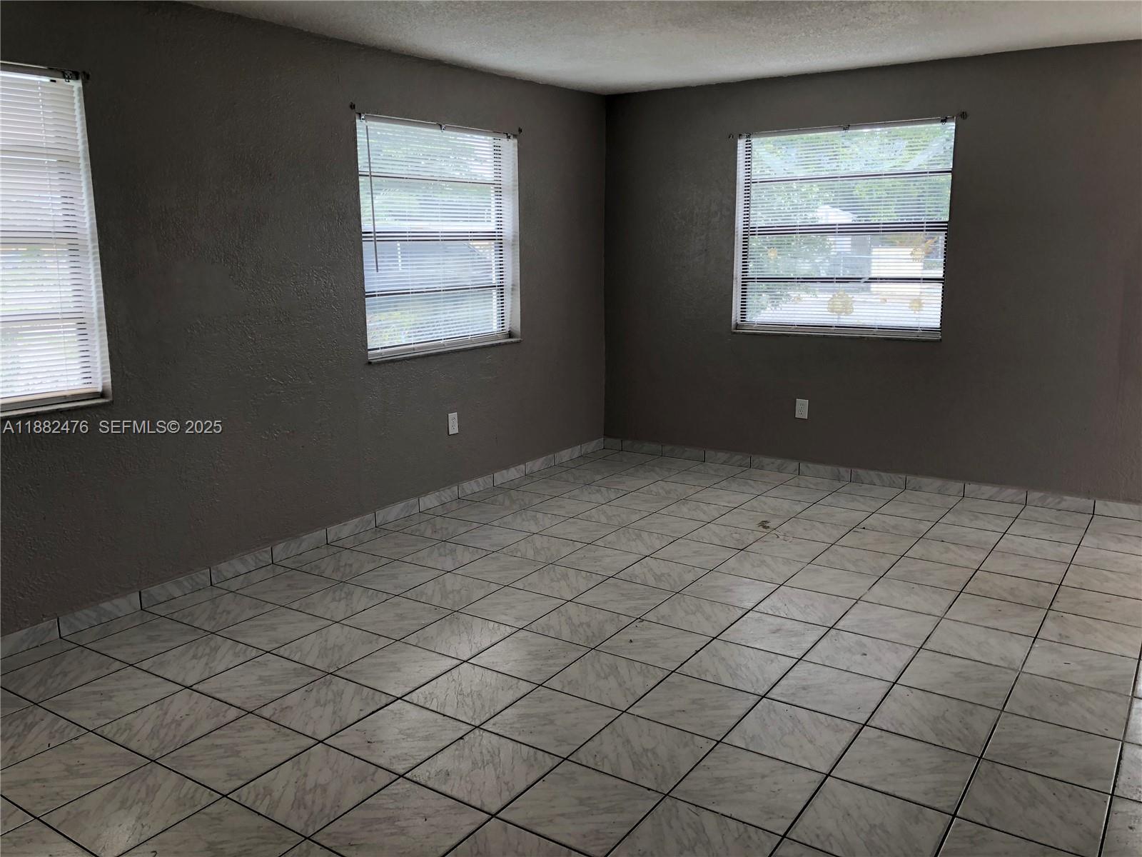 10250 Southwest 172nd Street Miami, FL 33157 - Photo 7 of 39 a view of an empty room and window