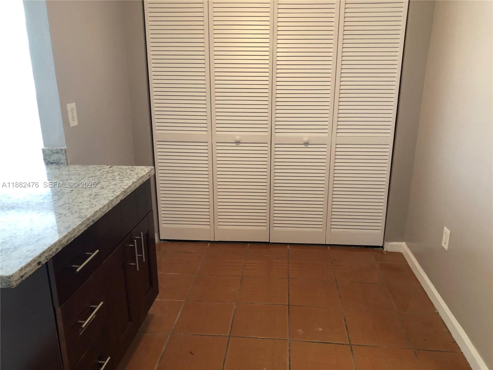 10250 Southwest 172nd Street Miami, FL 33157 - Photo 8 of 39 a bathroom with a granite countertop sink and white cabinets