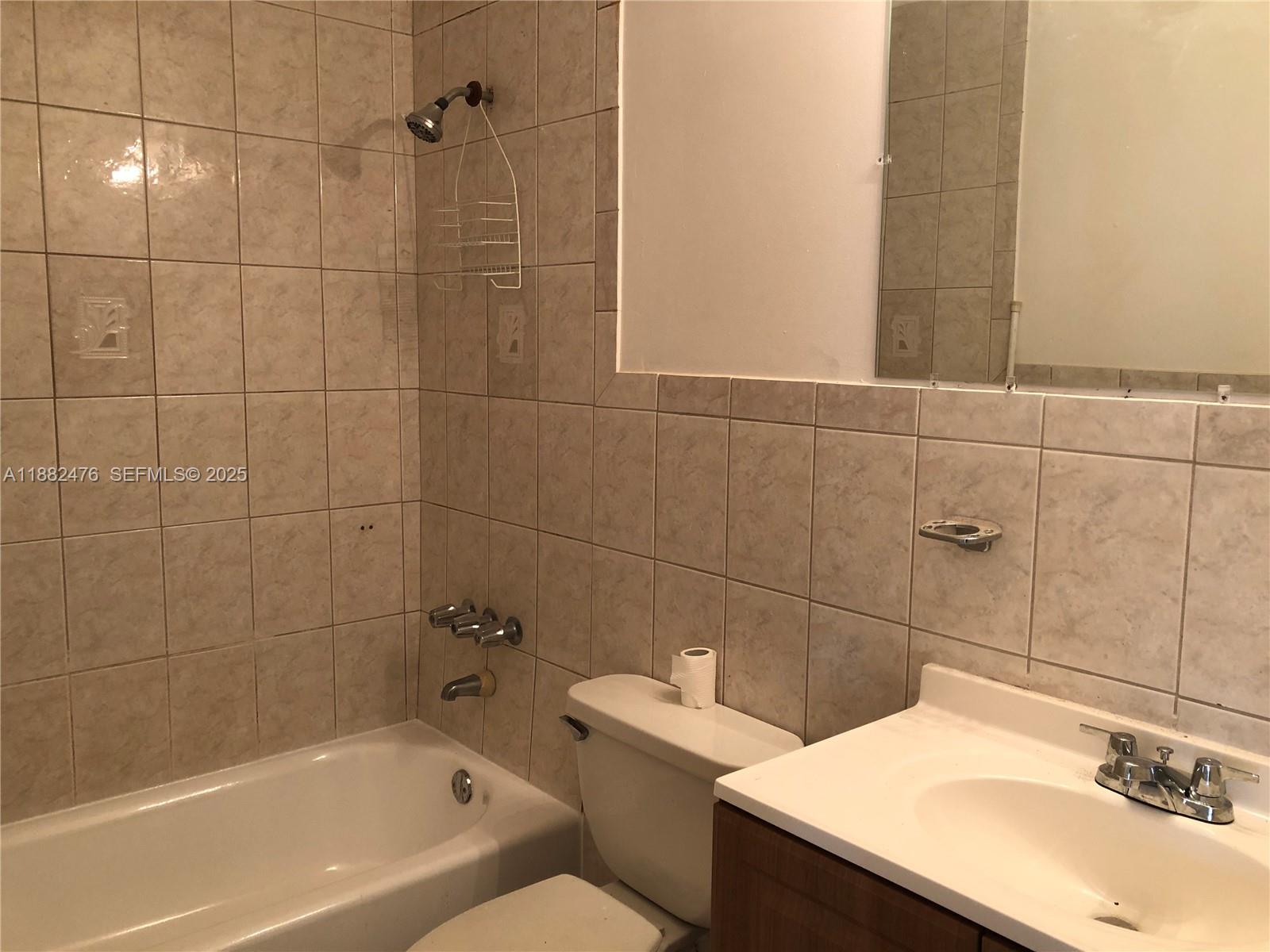 10250 Southwest 172nd Street Miami, FL 33157 - Photo 10 of 39 a bathroom with a sink shower and a bathtub