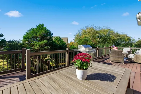 a bedroom with a large bed and a dresser