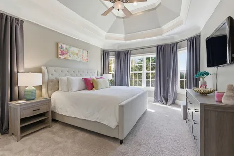 a bathroom with a granite countertop sink a toilet and a mirror