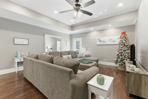 a view of a chair and table in backyard of the house