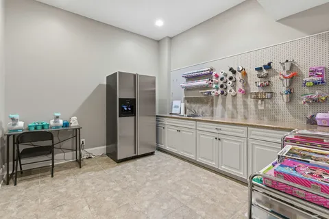 a view of swimming pool with outdoor seating and house in the background
