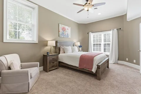 an aerial view of residential houses with outdoor space