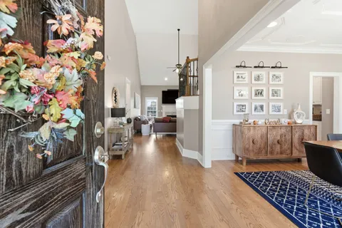 a living room with furniture fireplace and a flat screen tv