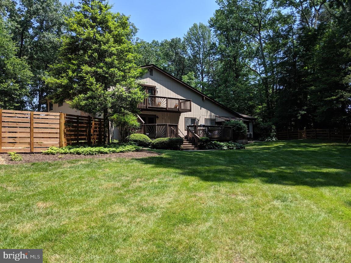 14316 Spriggs Road Woodbridge, VA 22193 - Photo 66 of 85 Summer View of the Back of the House