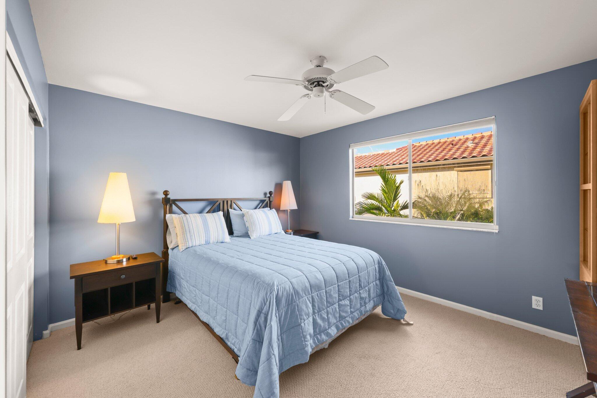 2595 Northwest 53rd Street Boca Raton, FL 33496 - Photo 19 of 48 a bedroom with a bed and a window