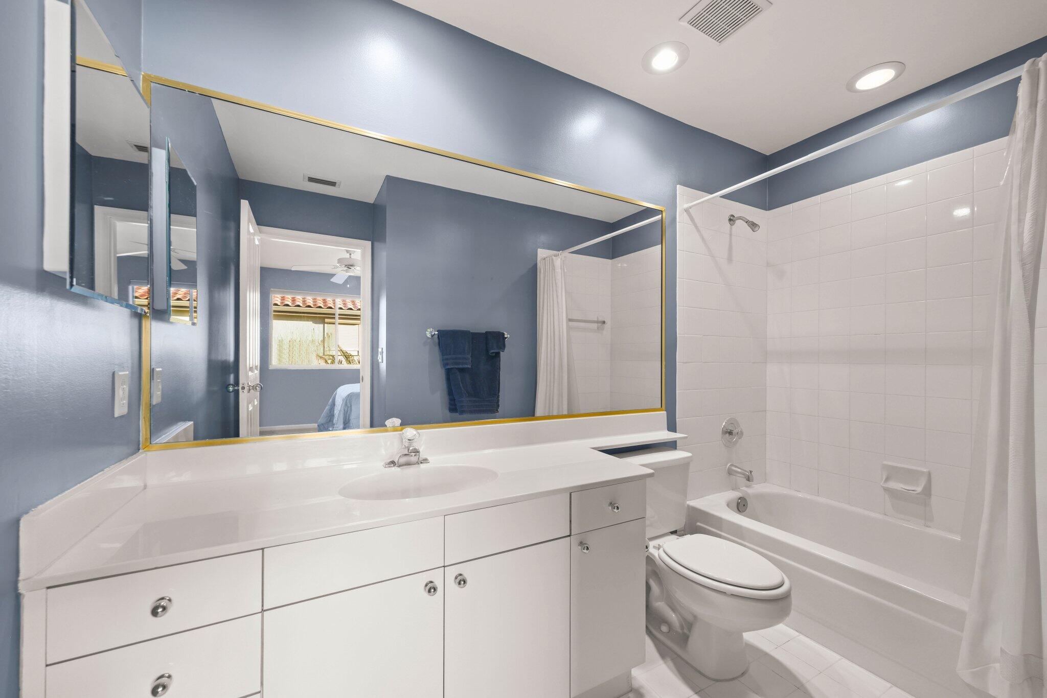 2595 Northwest 53rd Street Boca Raton, FL 33496 - Photo 20 of 48 a bathroom with a granite countertop sink toilet and shower