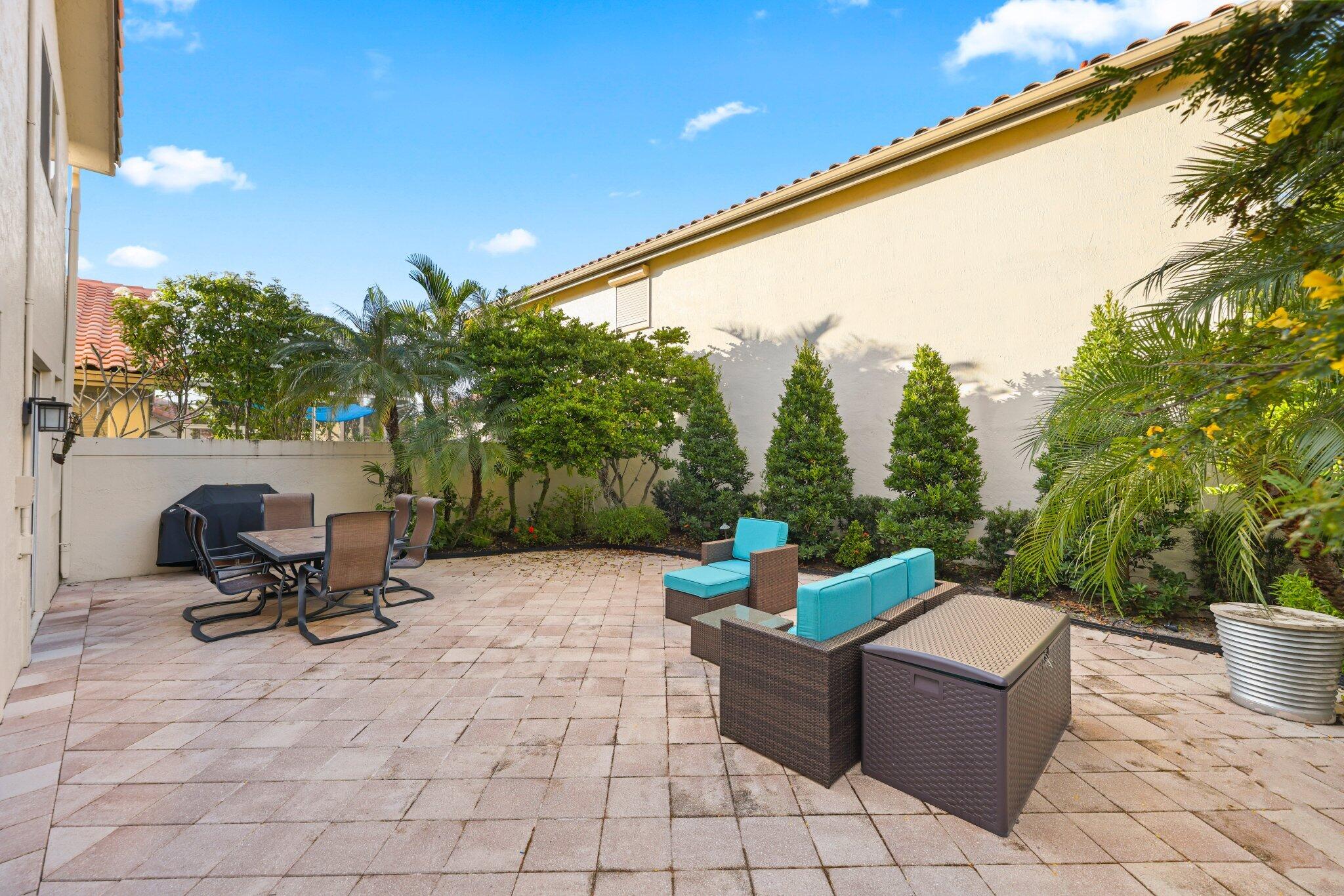 2595 Northwest 53rd Street Boca Raton, FL 33496 - Photo 23 of 48 a view of a terrace with chairs and a couch