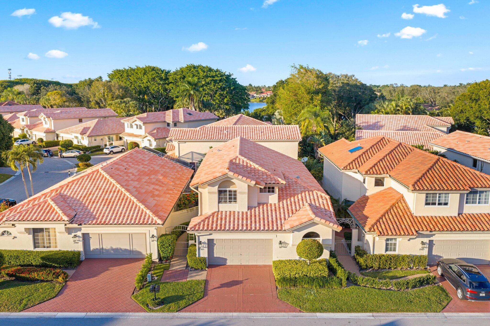 2595 Northwest 53rd Street Boca Raton, FL 33496 - Photo 24 of 48 a aerial view of a house with a garden and swimming pool
