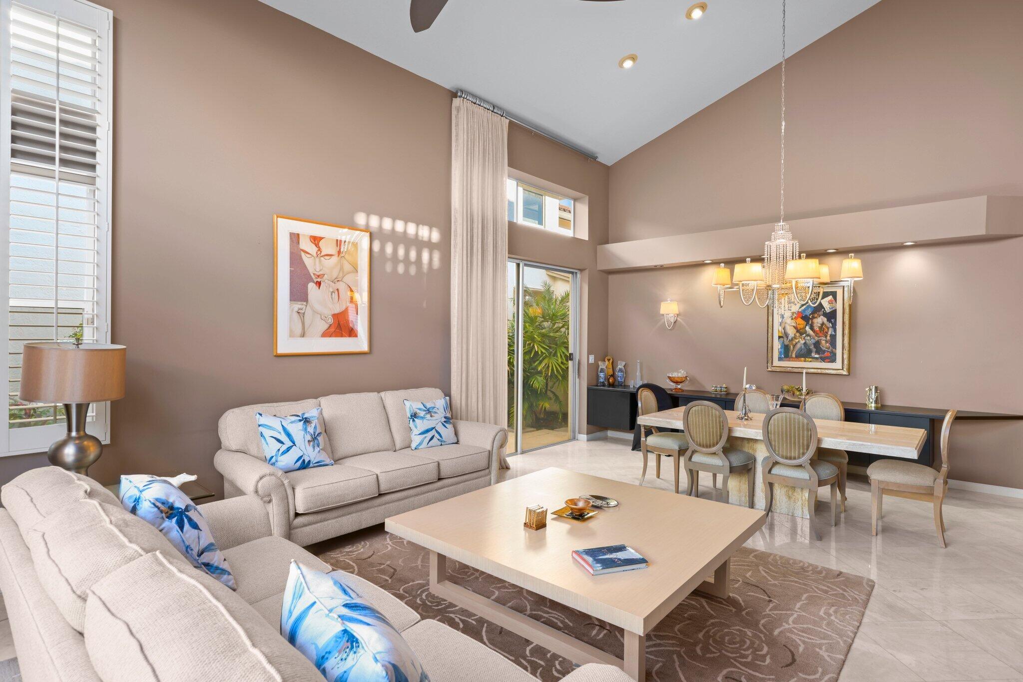 2595 Northwest 53rd Street Boca Raton, FL 33496 - Photo 3 of 48 a living room with furniture and a large window