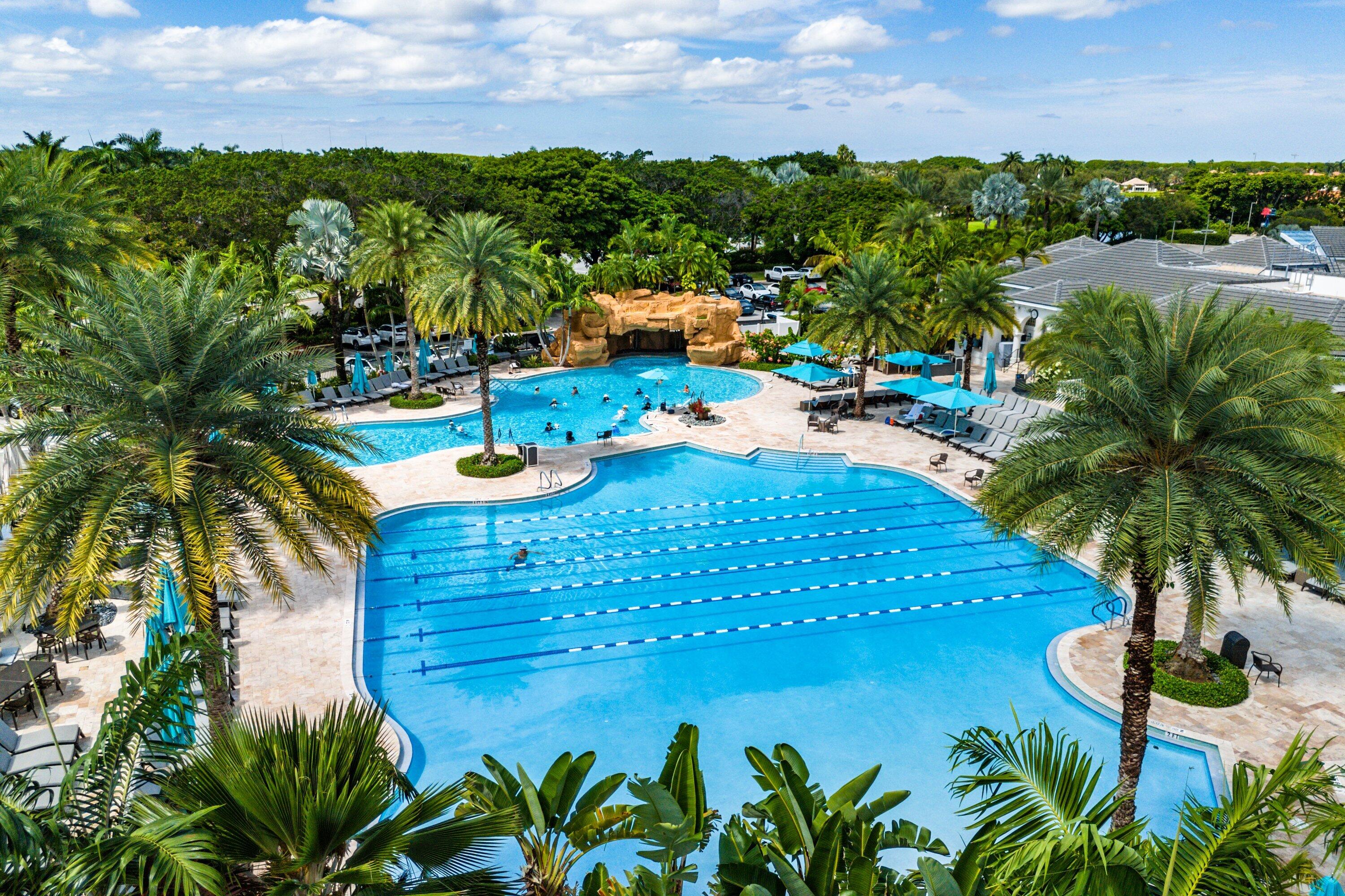2595 Northwest 53rd Street Boca Raton, FL 33496 - Photo 45 of 48 a view of a swimming pool and lounge chair