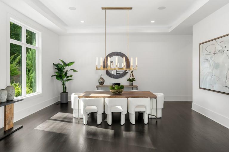 5211 Powers Ferry Road Northwest Sandy Springs, GA 30327 - Photo 37 of 106 a view of a dining room with furniture window and wooden floor