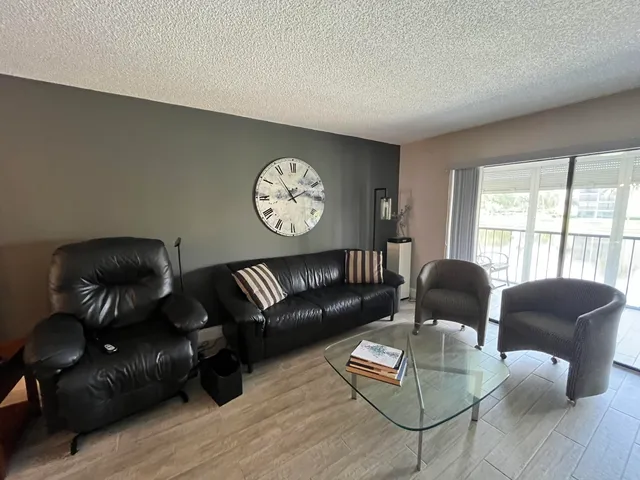 a view of living room with furniture and flat screen tv