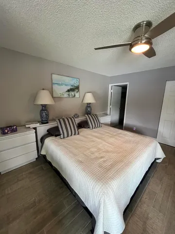 a workspace with wooden floor and a bathroom