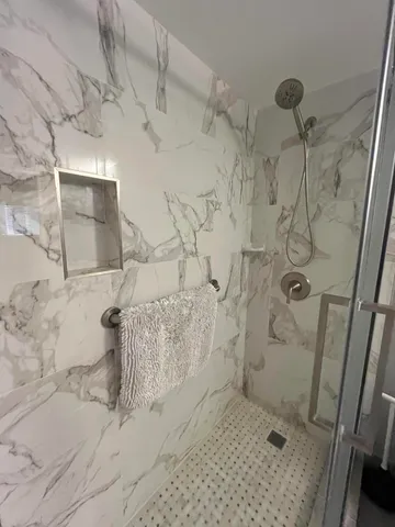 a view of hallway with furniture