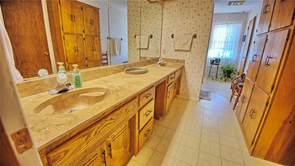 a spacious bathroom with a tub and shower