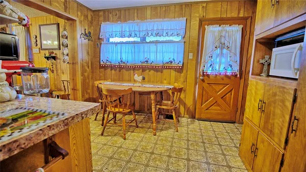 a view of a patio with table and chairs