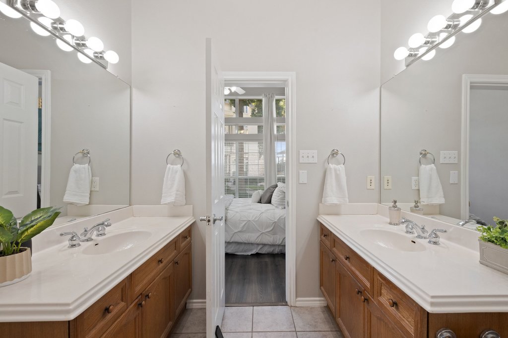 2918 Ranch Road 620 North, Unit 268 Austin, TX 78734 - Photo 5 of 40 Dual vanities in the primary bathroom