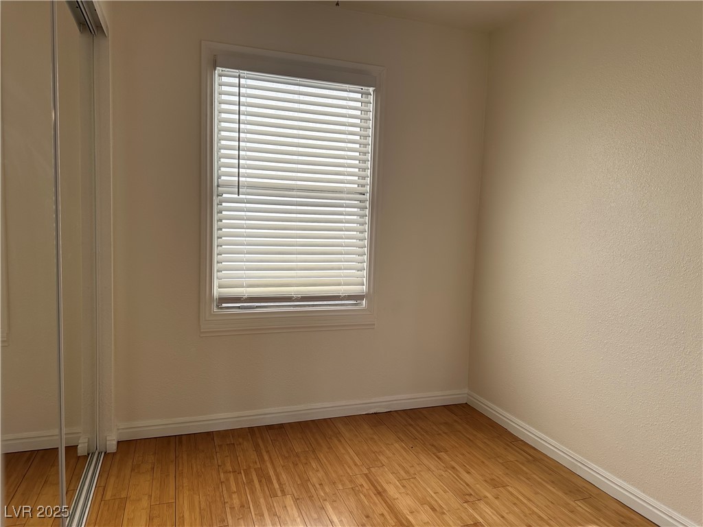 628 B, Unit C Boulder City, NV 89005 - Photo 5 of 12 Unfurnished room with light wood-type flooring and baseboards