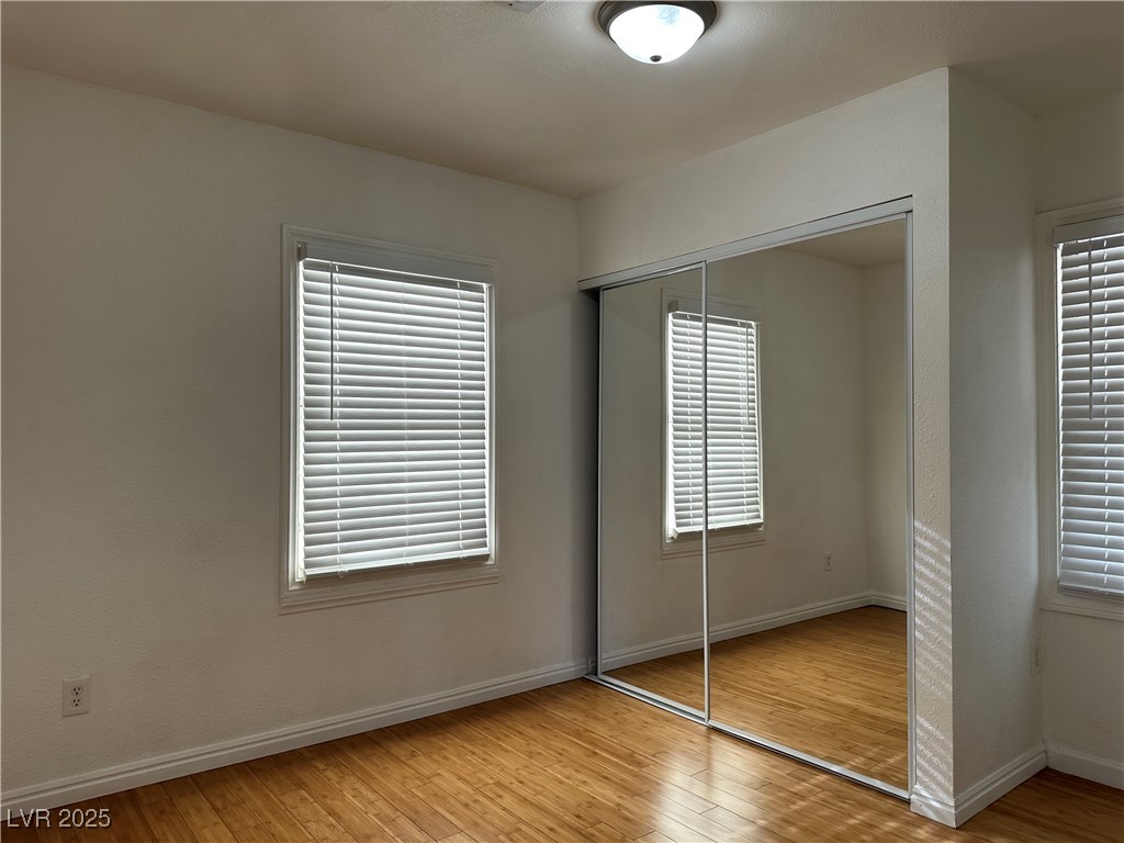 628 B, Unit C Boulder City, NV 89005 - Photo 6 of 12 Unfurnished bedroom featuring baseboards, a closet, and light wood finished floors