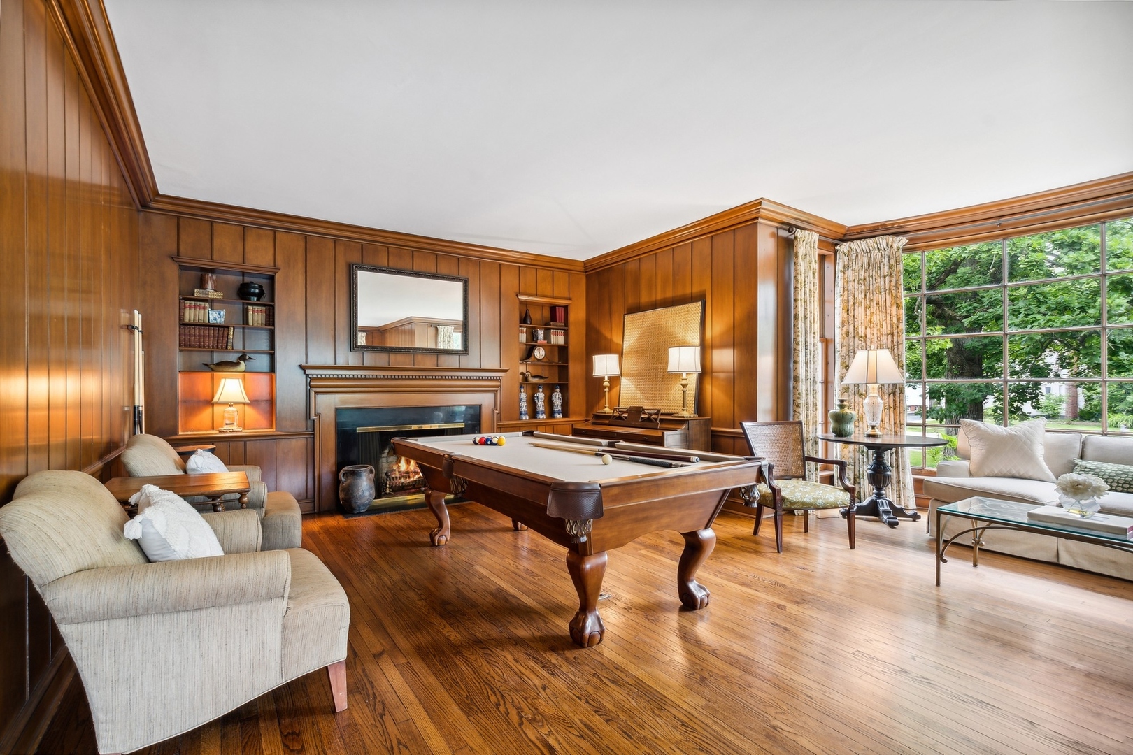 382 Ridge Avenue Winnetka, IL 60093 - Photo 11 of 43 a living room with furniture a large window and wooden floor