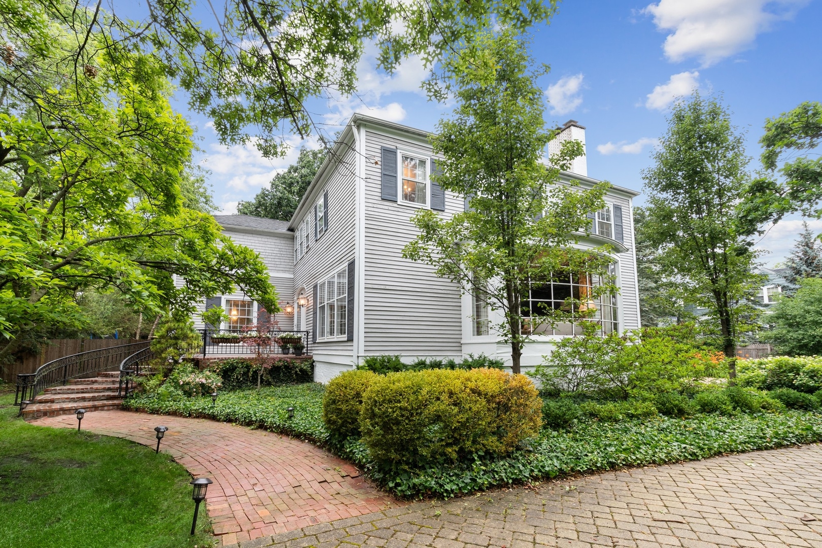 382 Ridge Avenue Winnetka, IL 60093 - Photo 2 of 43 a front view of a house with garden