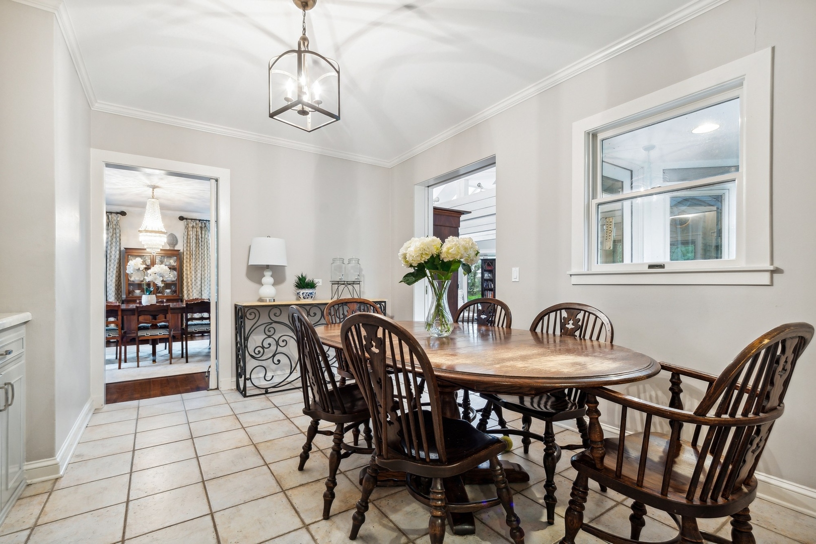 382 Ridge Avenue Winnetka, IL 60093 - Photo 22 of 43 a view of a dining room with furniture and chandelier
