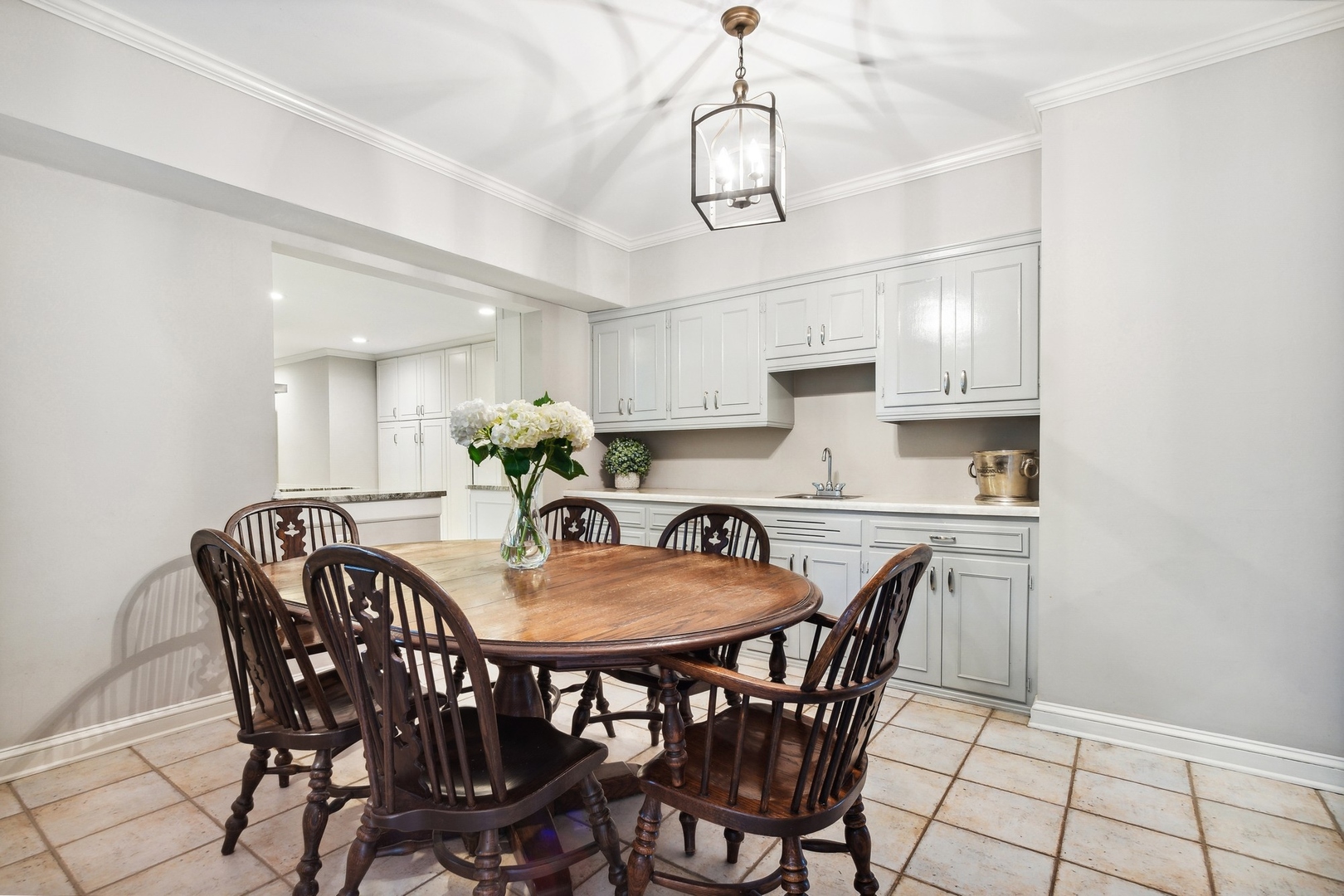 382 Ridge Avenue Winnetka, IL 60093 - Photo 23 of 43 a view of a dining room with furniture window and wooden floor