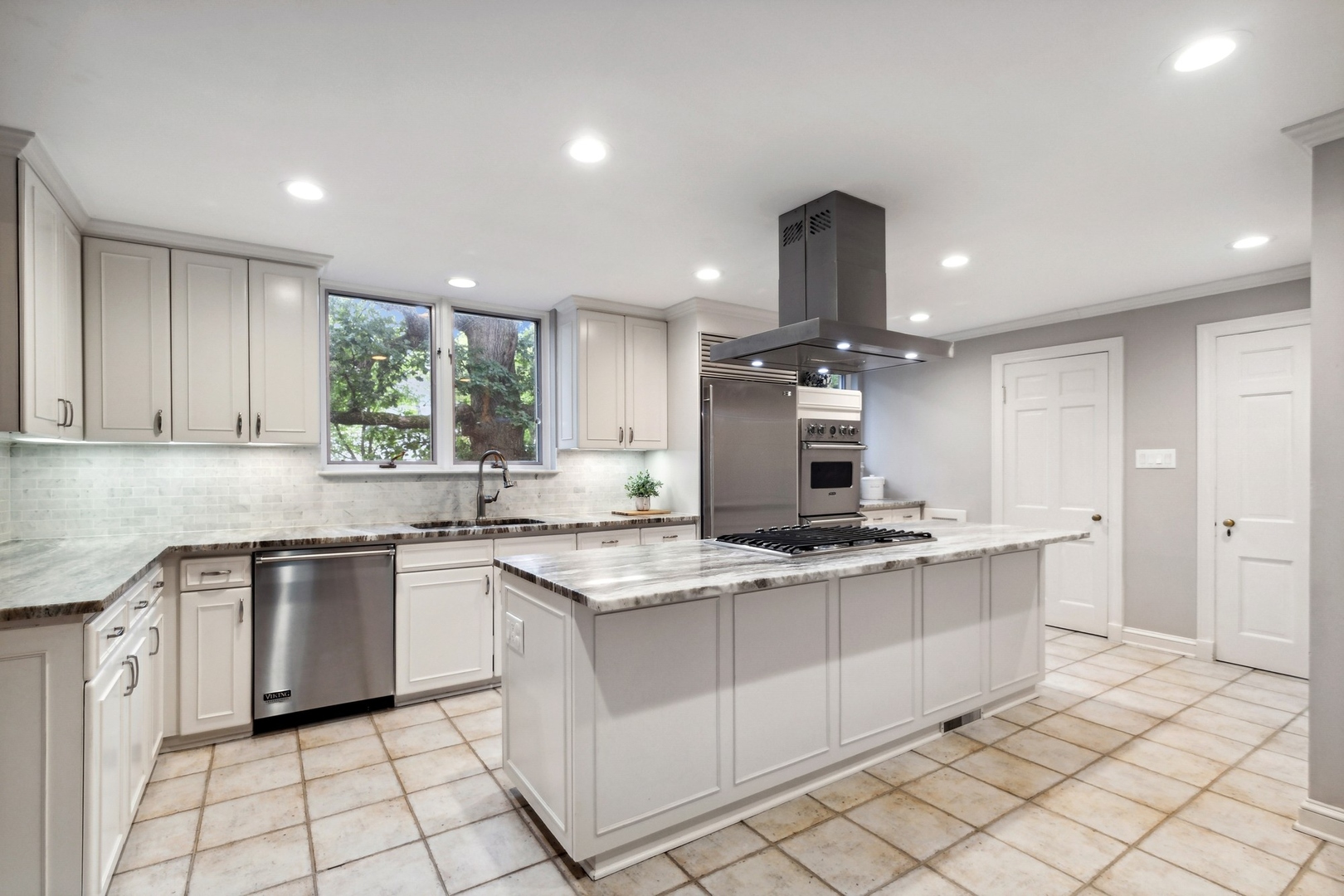 382 Ridge Avenue Winnetka, IL 60093 - Photo 25 of 43 a kitchen with a sink stove and cabinets