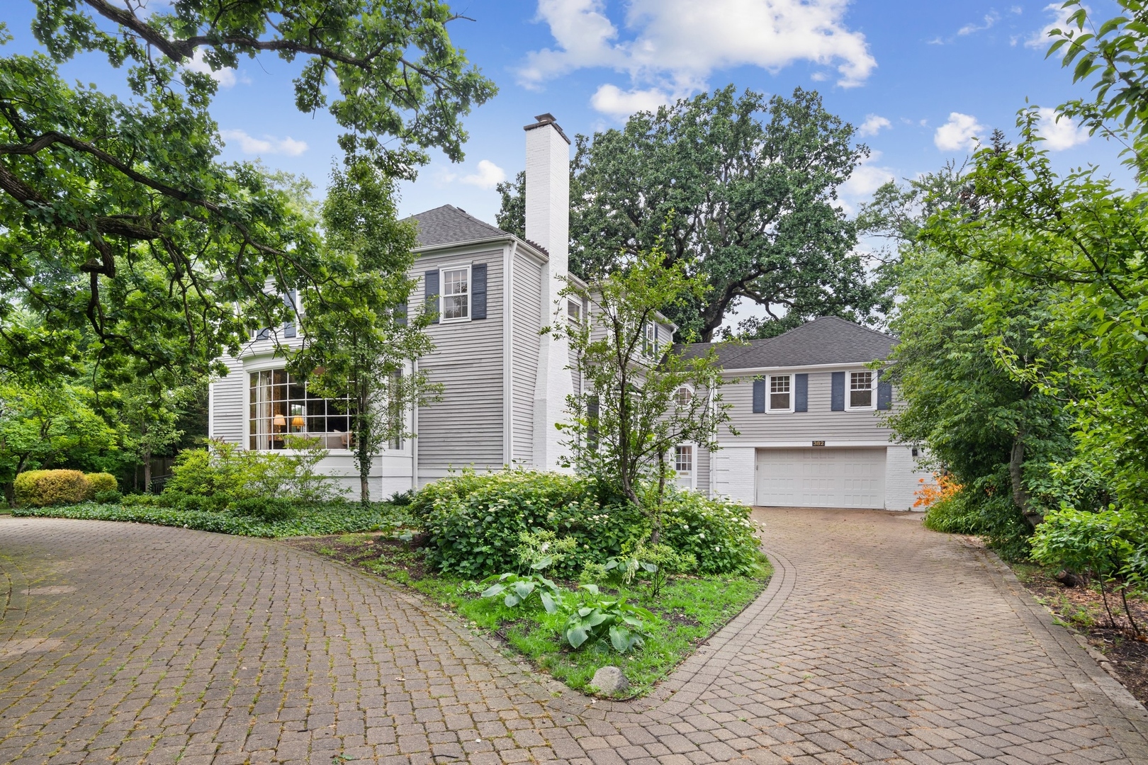 382 Ridge Avenue Winnetka, IL 60093 - Photo 3 of 43 front view of a house with a yard