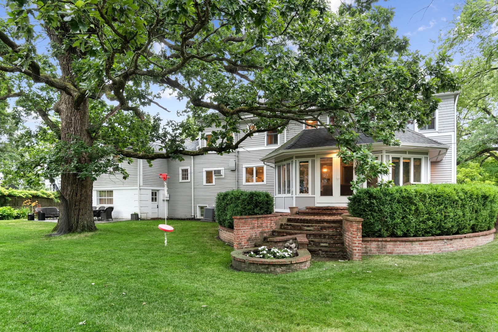 382 Ridge Avenue Winnetka, IL 60093 - Photo 41 of 43 a front view of a house with a yard and trees