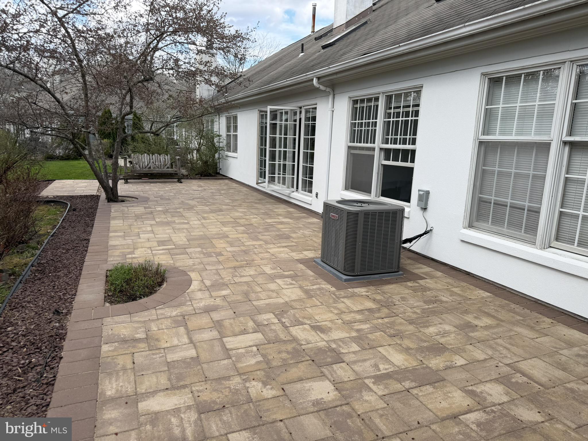 1 Wright Place Princeton Junction, NJ 08550 - Photo 13 of 27 Spacious patio with lush greenery.