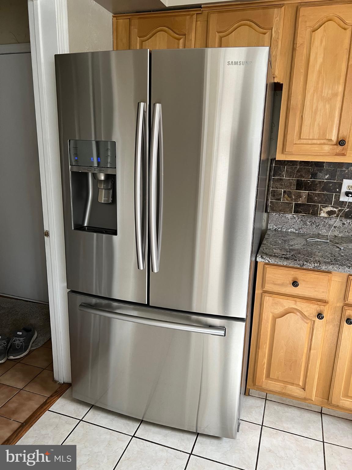 1 Wright Place Princeton Junction, NJ 08550 - Photo 3 of 13 a metallic refrigerator freezer sitting in a kitchen