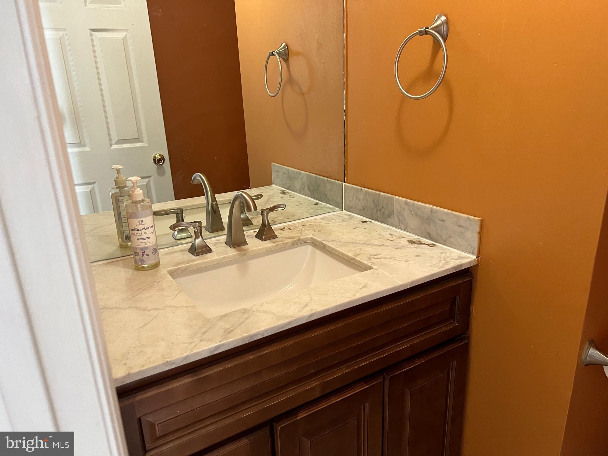 1 Wright Place Princeton Junction, NJ 08550 - Photo 5 of 13 a bathroom with a sink and a mirror