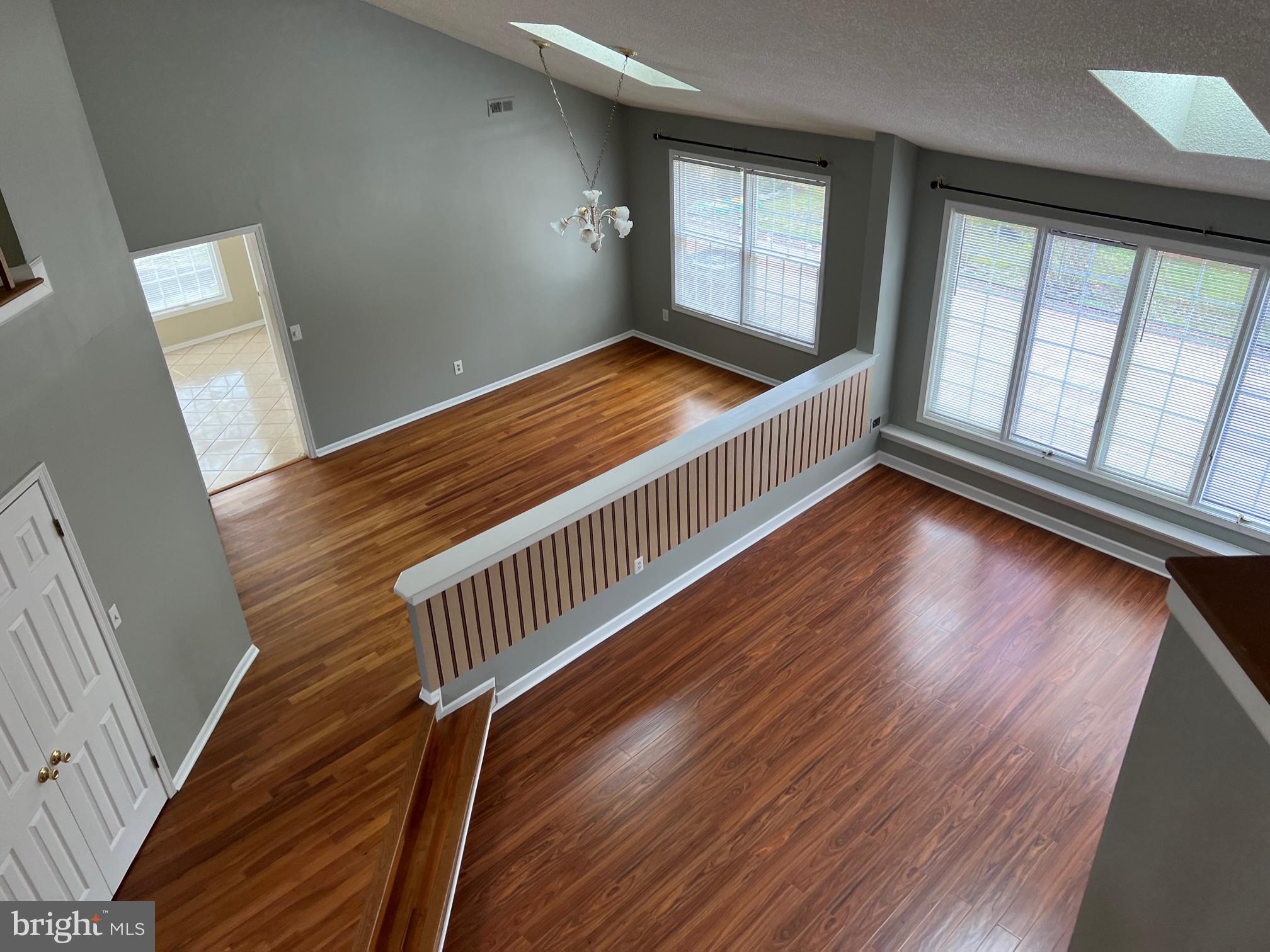 1 Wright Place Princeton Junction, NJ 08550 - Photo 6 of 13 a view of an empty room with wooden floor and windows