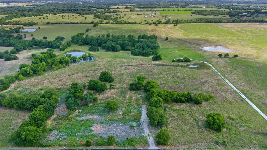 15036 County Road 1100 Blue Ridge, TX 75424 - Photo 3 of 9 a view of a lake with a city view