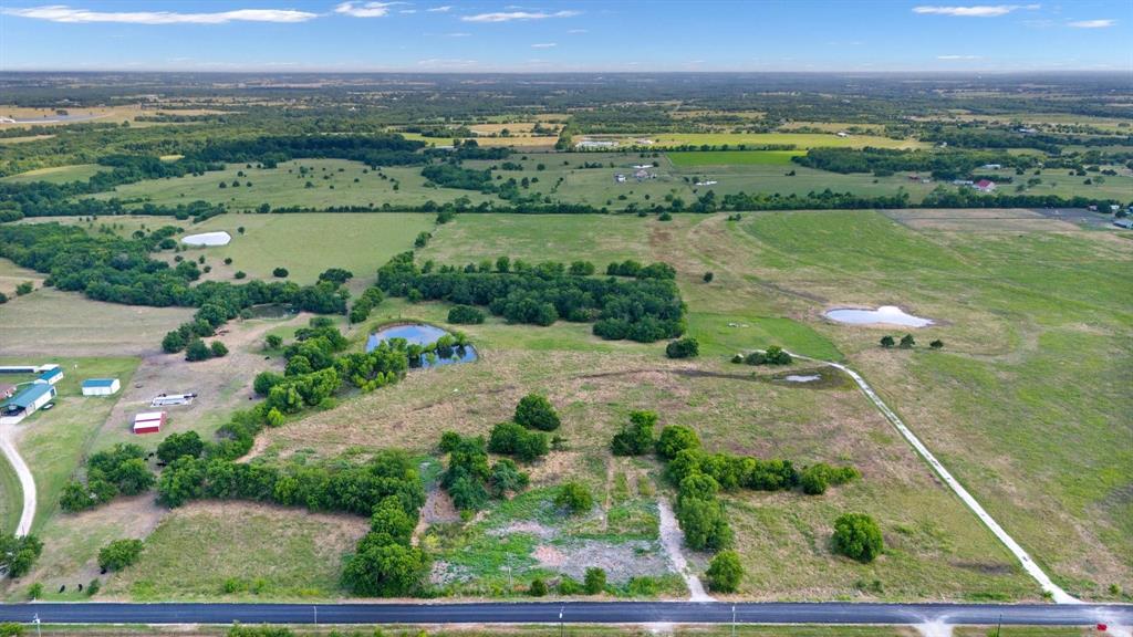 15036 County Road 1100 Blue Ridge, TX 75424 - Photo 4 of 9 an aerial view of ocean with residential house and lake view