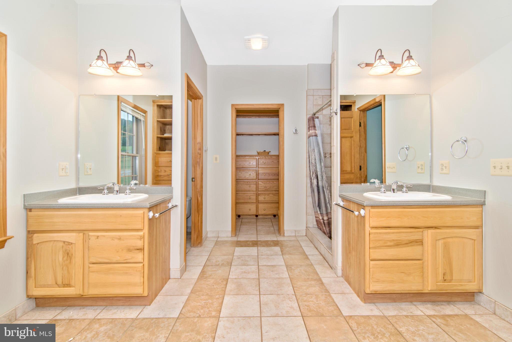 7728 Marker Road Middletown, MD 21769 - Photo 14 of 30 a bathroom with a sink a vanity and a mirror