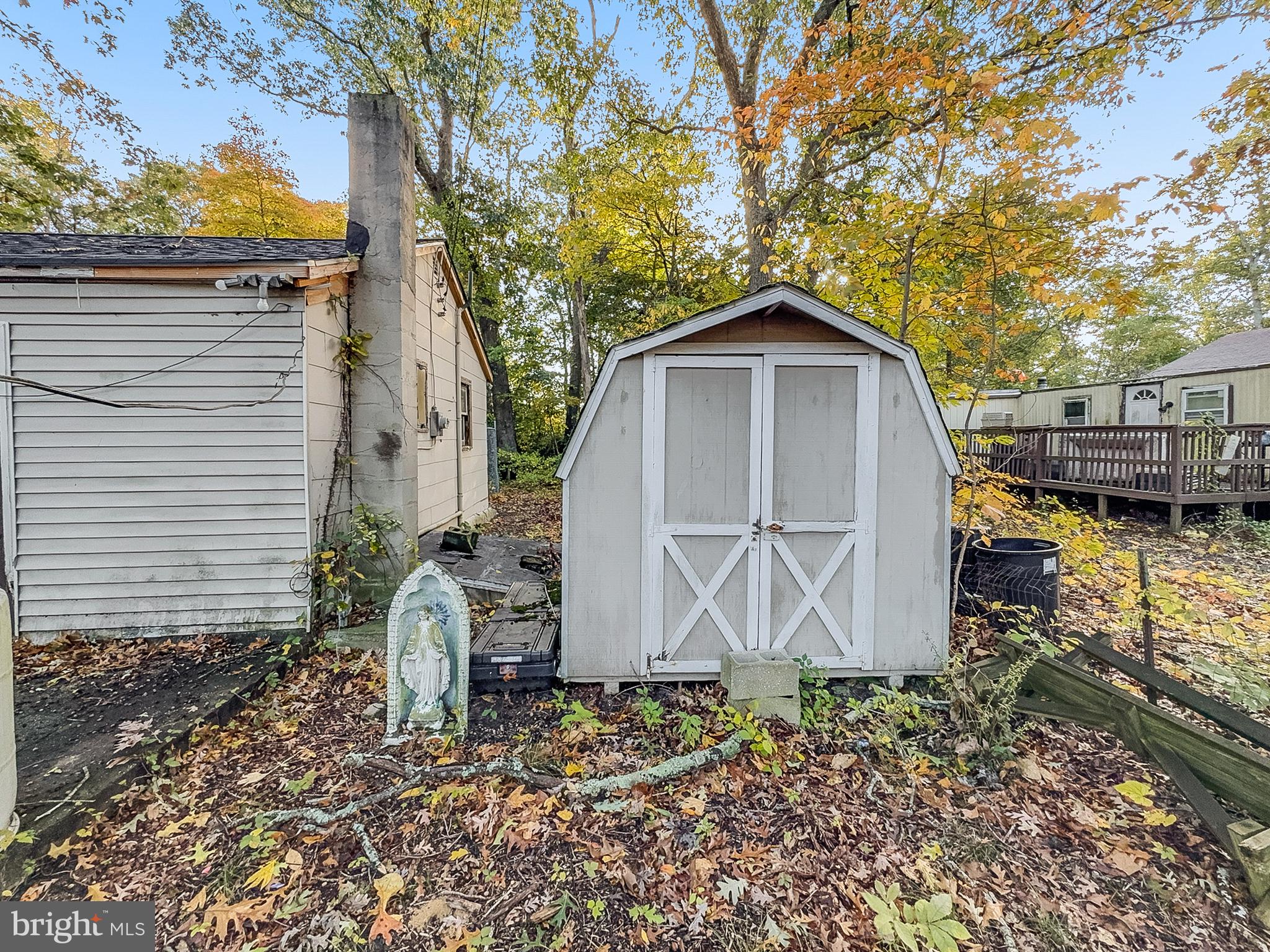 108 Quail Road Millville, NJ 08332 - Photo 12 of 14 a view of a small house with a tree and wooden fence