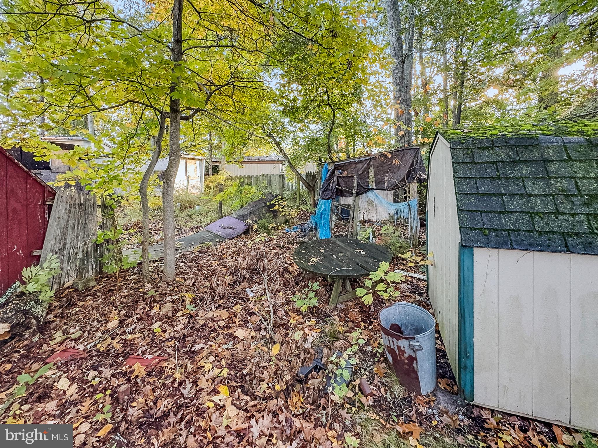 108 Quail Road Millville, NJ 08332 - Photo 13 of 14 a backyard of a house with table and chairs