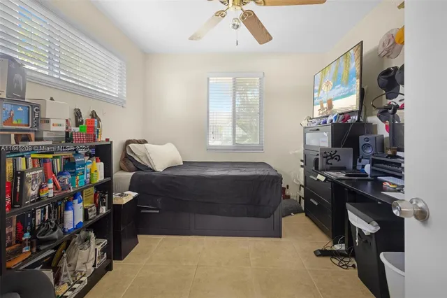 a bedroom with furniture and a book shelf