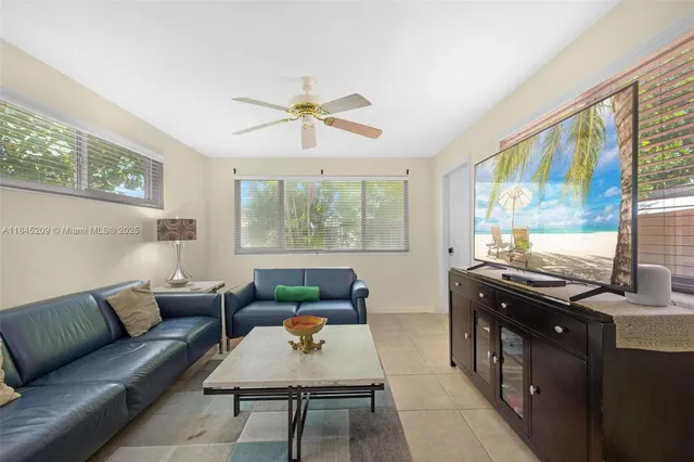 a living room with furniture and a window