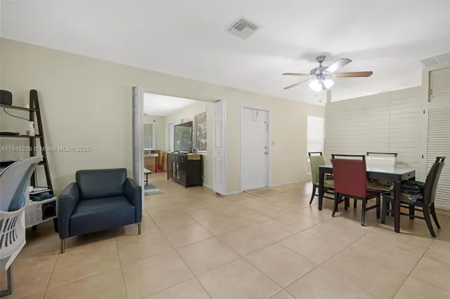 a view of a livingroom with furniture and a workspace