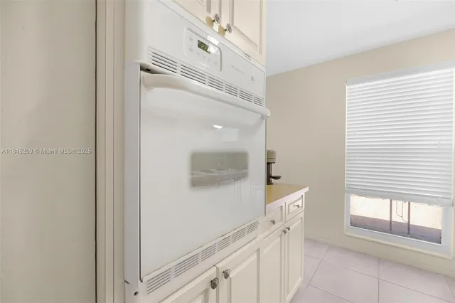 a bedroom with a large bed and a large window